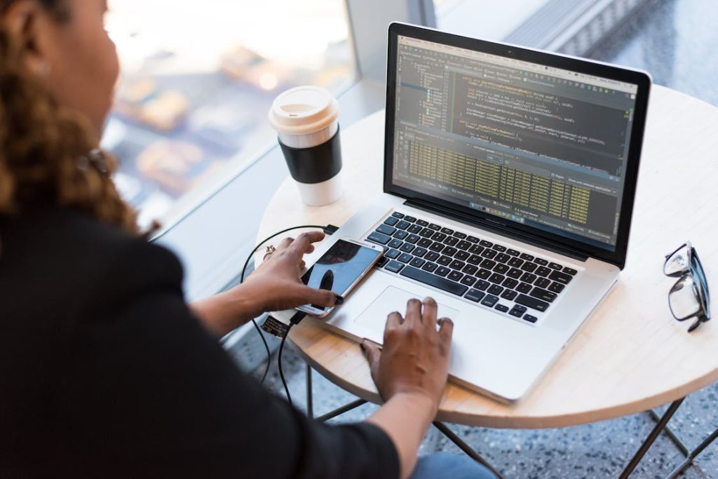 Woman using custom web & software solution on her laptop